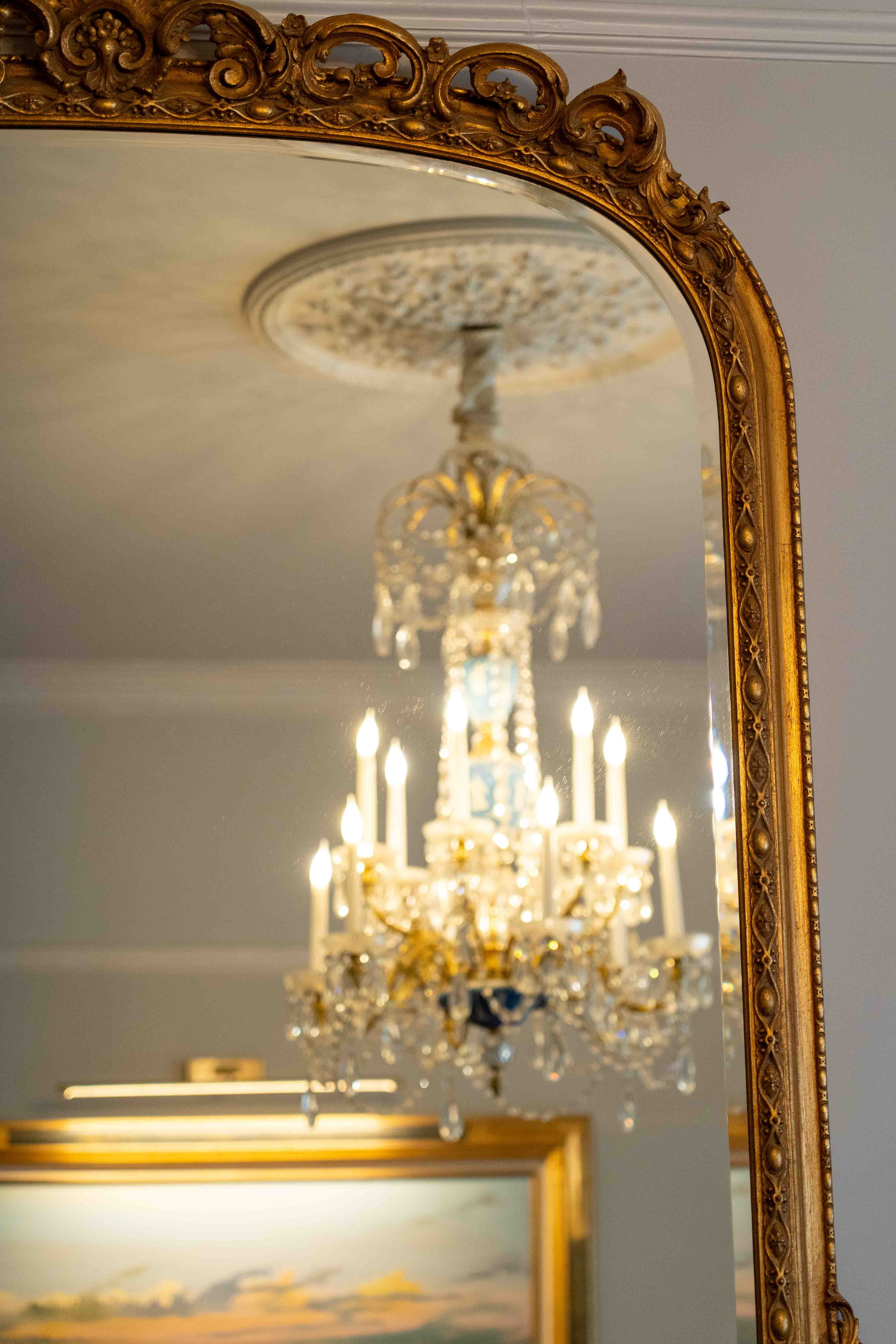 A Victorian style giltwood and composition overmantel mirror, width 140cm, height 164cm. Condition - good